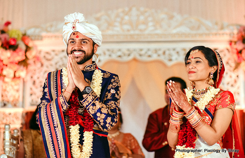 Cute indian bride and groom holding hands