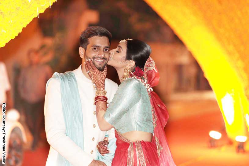 Marvellous capture of Bride kissing Indian Groom 