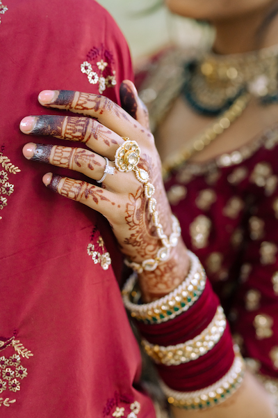 Indian bride wearing Pohcha in her hand