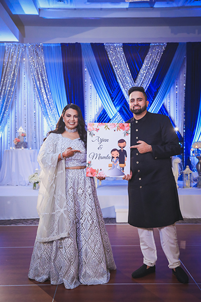 Couple holding picture and posing