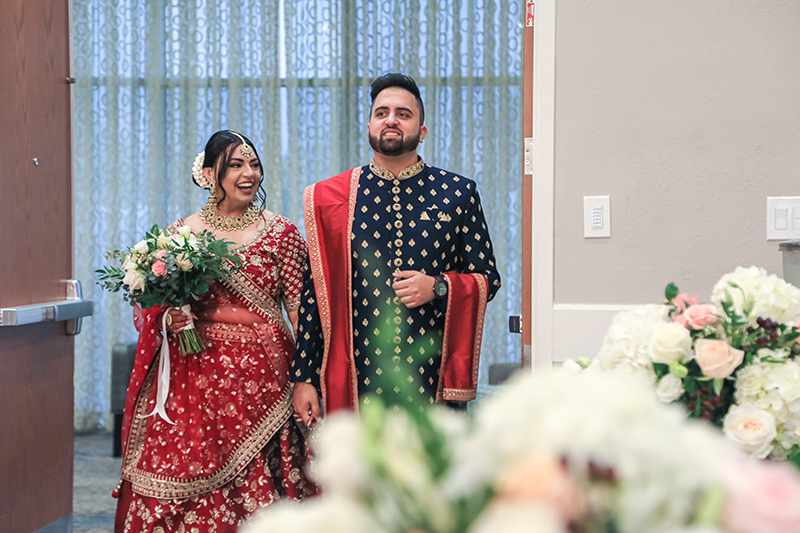 Indian couple entering wedding venue