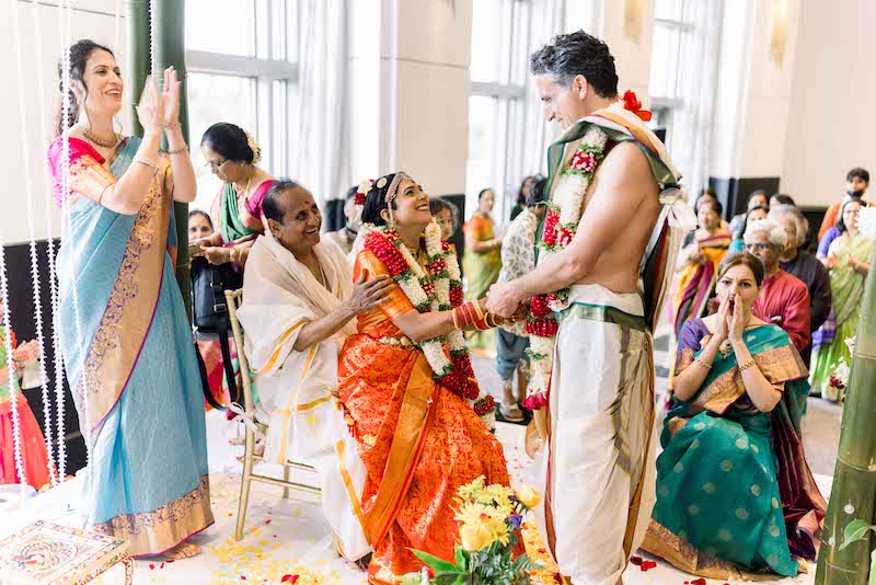 Indian Bride having Fun at ceremony