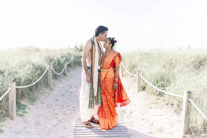 Groom kissing On forehead of Bride