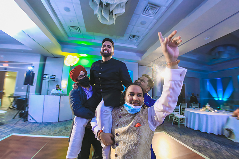 Groom having fun at wedding party