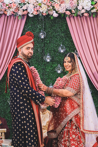 Indian bride wears garland to Groom