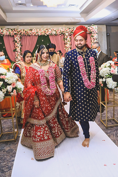 Indian couple entering wedding venue