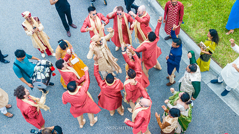 Groom dancing with friends and family In Wedding Baraat