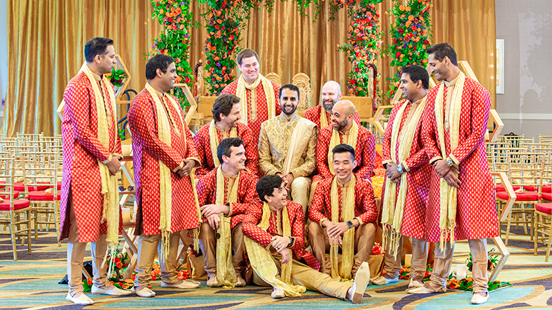 Groom posing with groomsmen