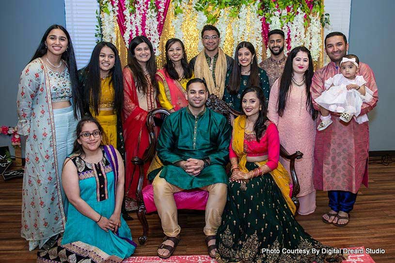 Indian wedding couple with their family capture