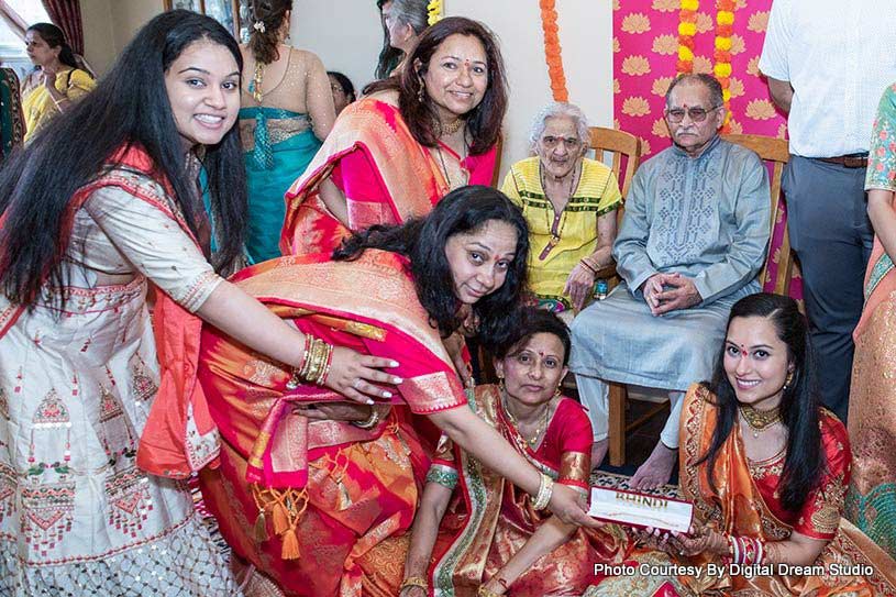 Indian Groom's Parents giving gift to Indian Bride