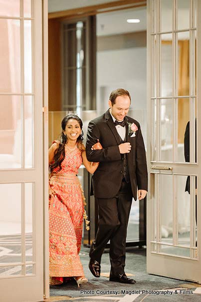 Bride entering at the venue with groom