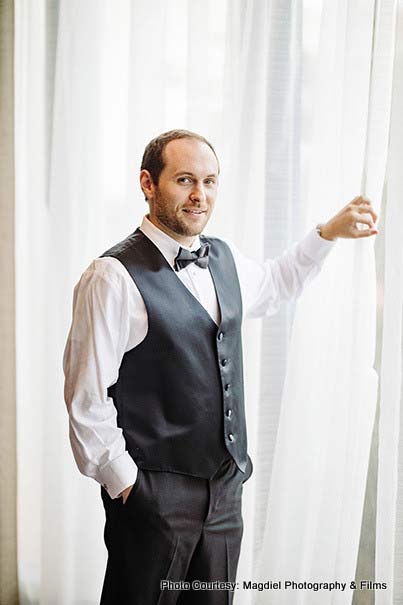 Groom posing for a photo