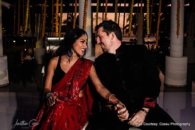 Indian couple posing at wedding reception
