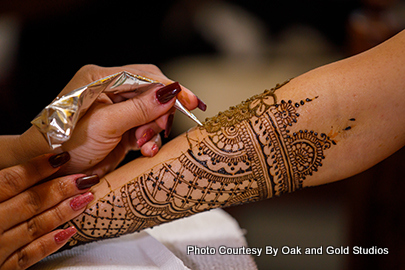 Dazzling Indian Bride showing her mehendi