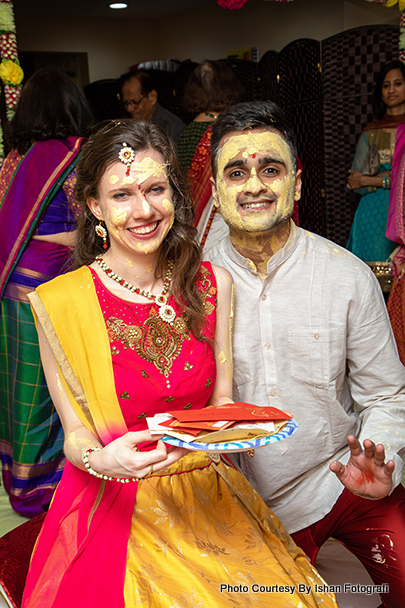 Haldi applied on bride and groom's face