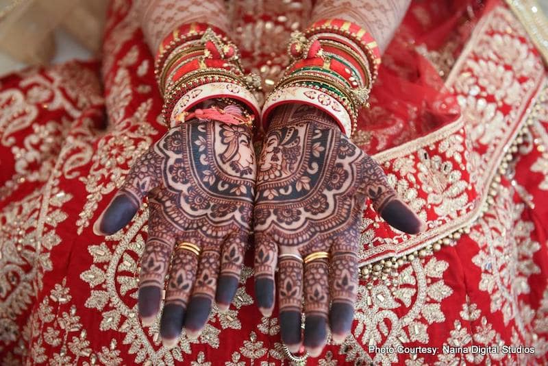 Dazzling Indian Bride showing her mehendi