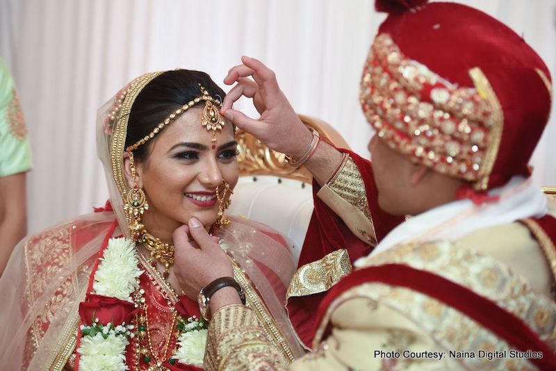 Indian Groom Putting Sindur on Birde's Head