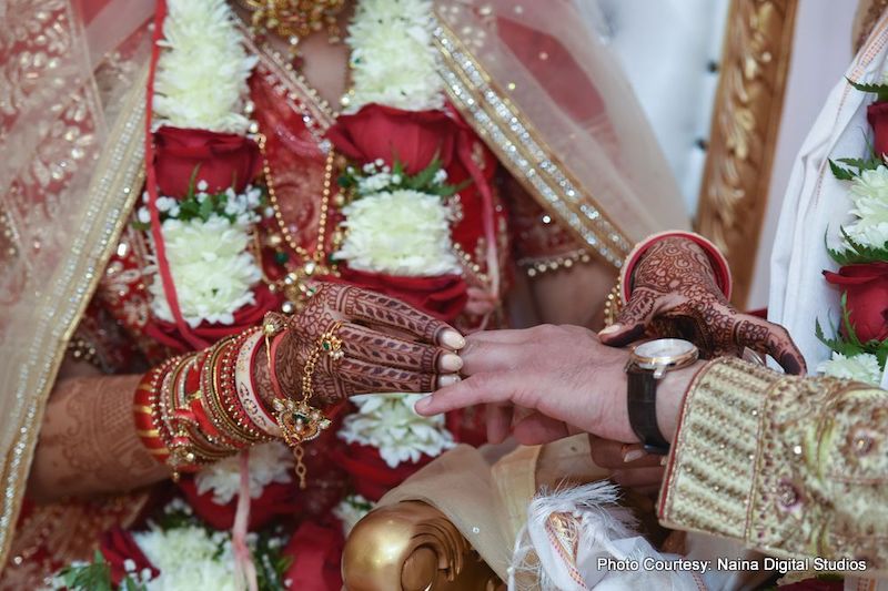 Bride going to put ring to groom's finger