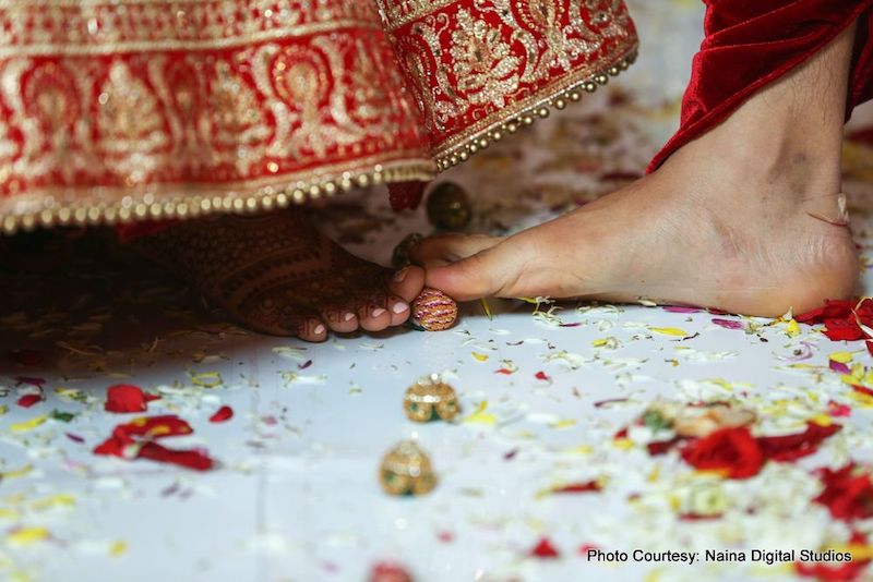 Indian Couple putting toes on sopari