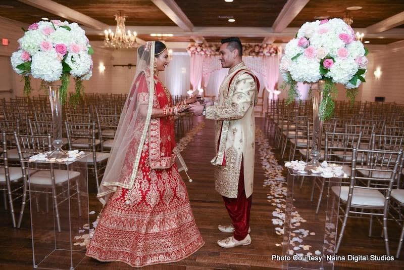 Indian Wedding couple holding each other's hands