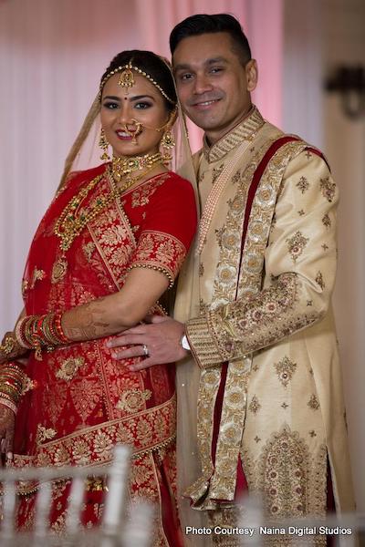 Indian Bride and groom smiling during photoshoot