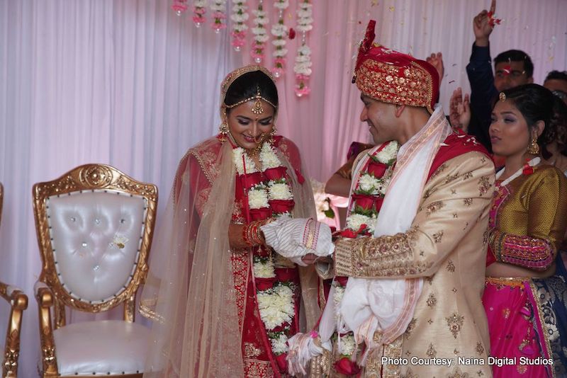 Indian Bride and Groom under wedding Mandap