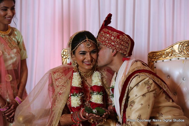 Indian Groom kissing to Indian Bride