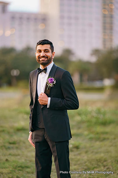 Purple flower looks beautiful on black blazer