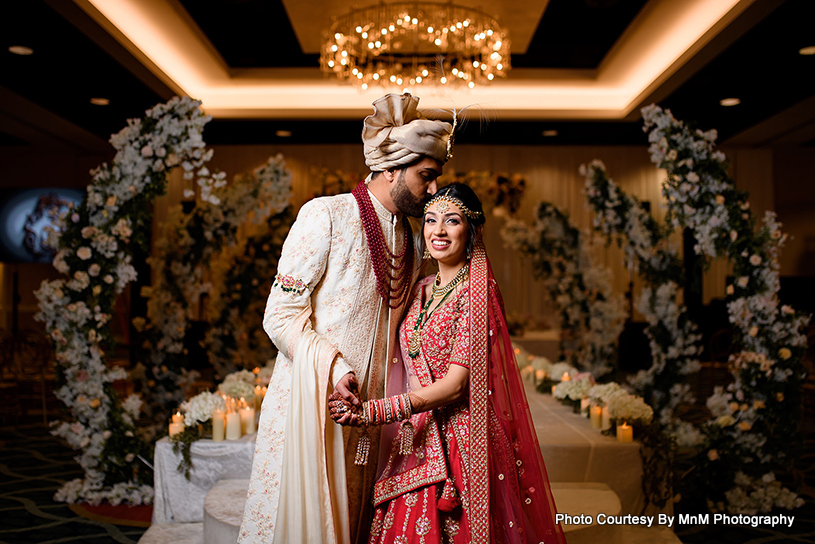 Indian Groom Kissing on Indian Bride's Head 