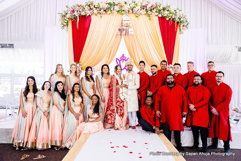 Groomsmen in Red and Bridesmaids in pink look so beautiful