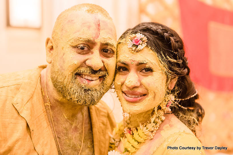 Bride and groom looks yellow in Turmeric paste
