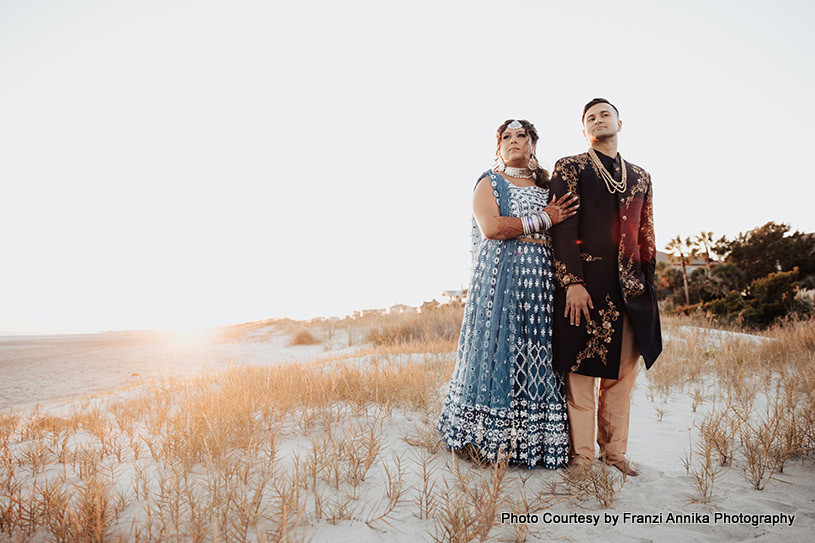 Indian bride and groom possing for outdoor shoot