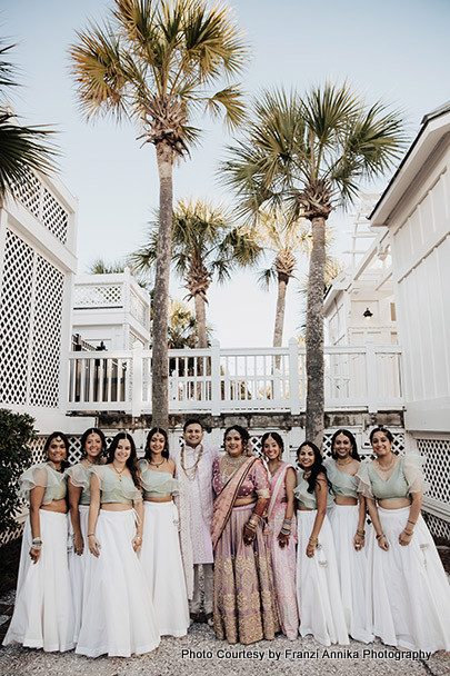 Indian bride and groom with bridesmaid