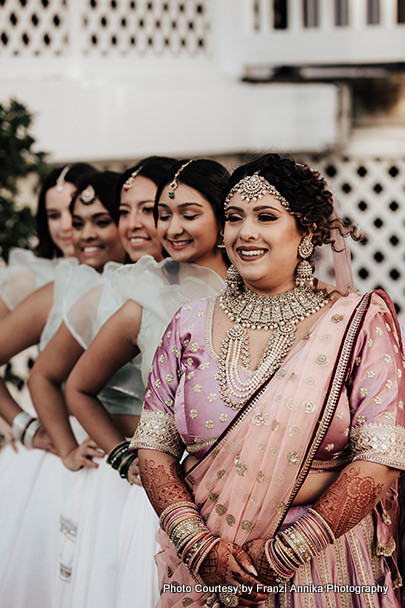 Indian bride and bridesmaid possing for photoshoot