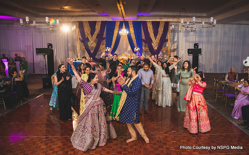 Indian bride and groom enjoying on dance floor