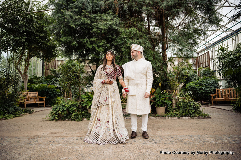 Indian Wedding Couple holding each other hand