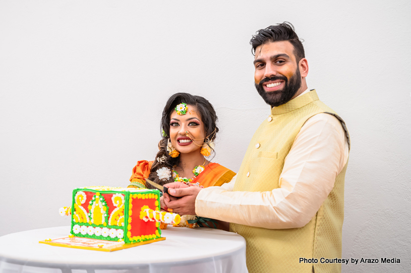 Bride and Groom Slicing the cake together