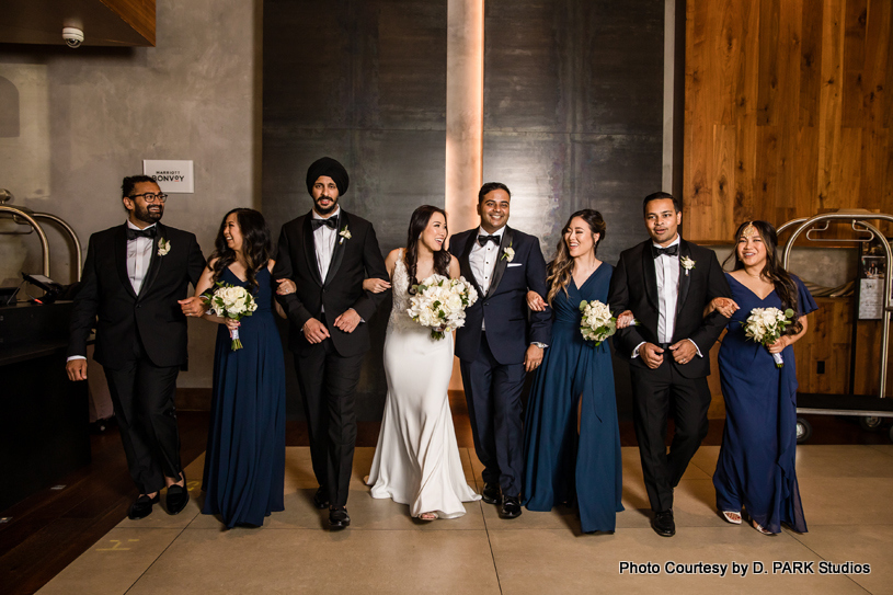 happy wedding couple with bridesmaid and groomsmen