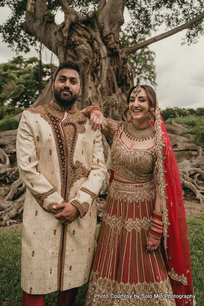 Indian wedding couple possing for outdoor photoshoot