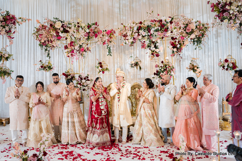 Indian wedding couple under Wedding mandap