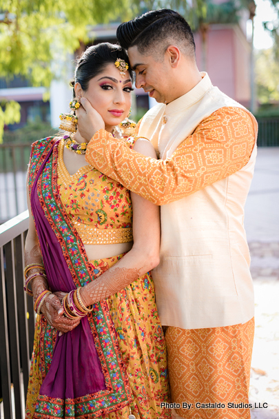 Indian groom showing his love to bride capture