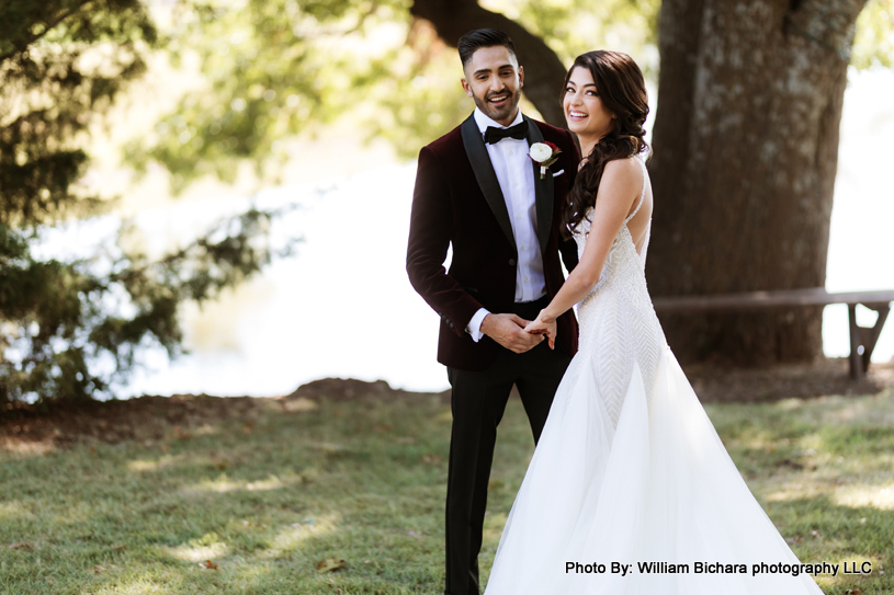 Smiling bride and groom surrounded by nature