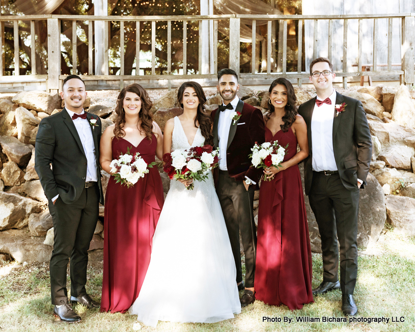 Couple Posing with bridesmaids and groomsmen
