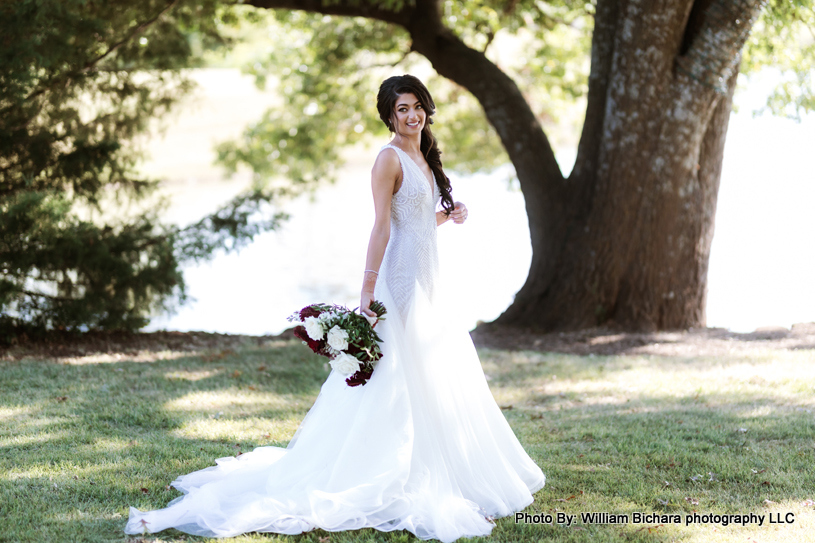 Smiling bride holding a bouquet of flowers