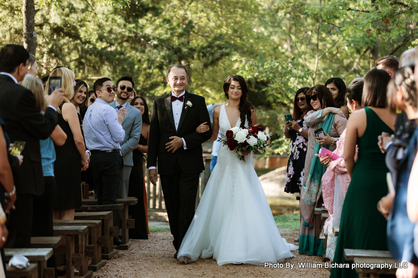 Bride walking down the aisle with her father