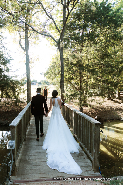 Bride and groom walking hand in hand as husband and wife