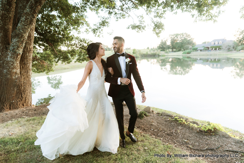 Euphoric bride and groom embracing in celebration