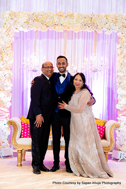 Indian groom with his parents capture