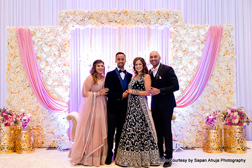 Indian bride and groom with their relatives capture