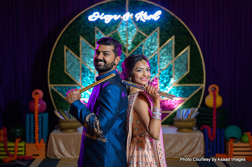 Indian bride and groom ready for dandiya raas